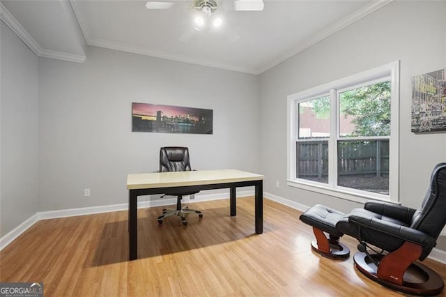 home office featuring crown molding, ceiling fan, and wood finished floors