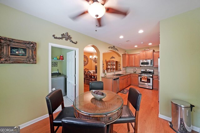718 Province Pl SE, Atlanta, GA 30312 - dining area with arched walkways, ceiling fan, light wood-type flooring, baseboards, and recessed lighting