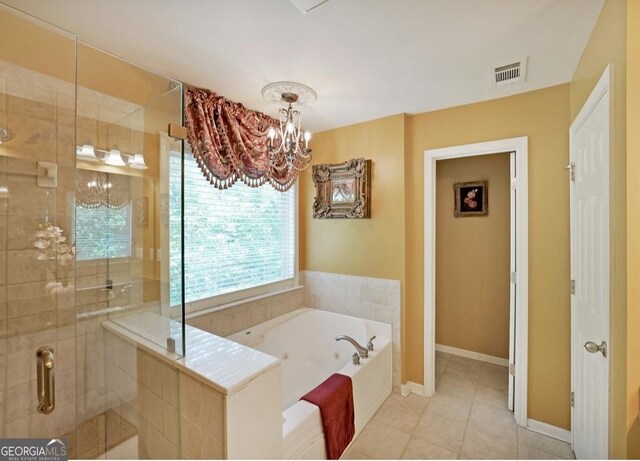 718 Province Pl SE, Atlanta, GA 30312 - bathroom featuring a whirlpool tub, a shower stall, a chandelier, tile patterned flooring, and baseboards