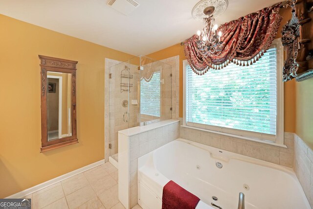 718 Province Pl SE, Atlanta, GA 30312 - bathroom featuring a whirlpool tub, a shower stall, a chandelier, and tile patterned flooring