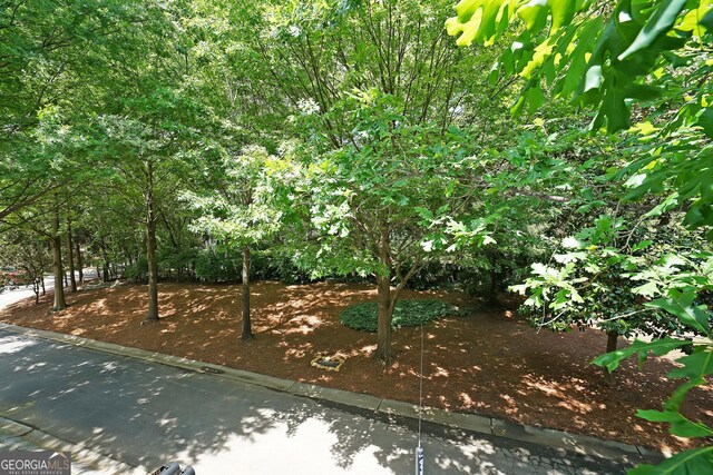 718 Province Pl SE, Atlanta, GA 30312 - view of front facade featuring a balcony, a chimney, a front lawn, and brick siding