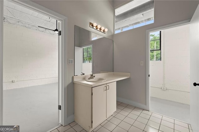 830 Dekalb Ave Unit 1, Atlanta, GA 30307 - bathroom with tile patterned flooring, vanity, and a healthy amount of sunlight