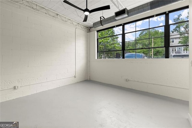 830 Dekalb Ave Unit 1, Atlanta, GA 30307 - interior space featuring a ceiling fan, a wealth of natural light, concrete block wall, and concrete floors