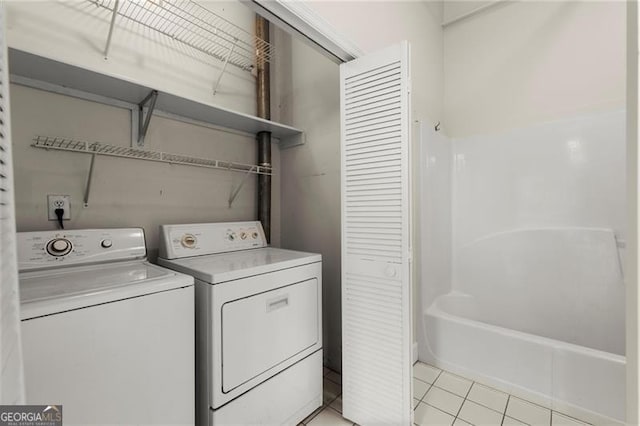 830 Dekalb Ave Unit 1, Atlanta, GA 30307 - laundry room with separate washer and dryer, light tile patterned flooring, and laundry area