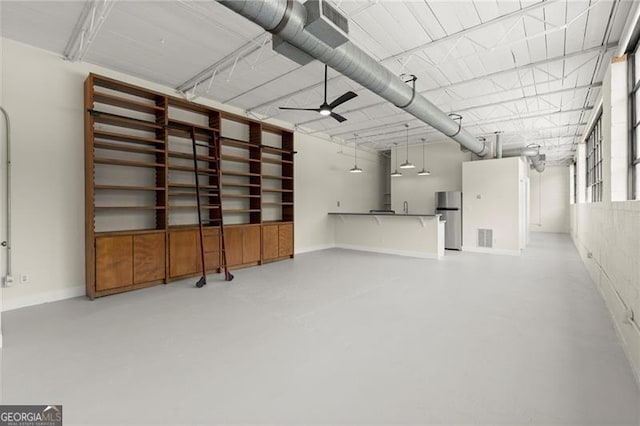 830 Dekalb Ave Unit 1, Atlanta, GA 30307 - garage featuring visible vents, ceiling fan, freestanding refrigerator, and baseboards