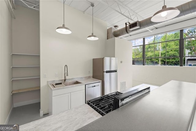 830 Dekalb Ave Unit 1, Atlanta, GA 30307 - kitchen with baseboards, stainless steel appliances, a healthy amount of sunlight, and a sink