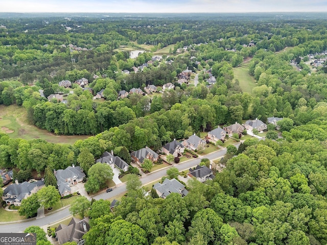 aerial perspective of suburban area with a forest