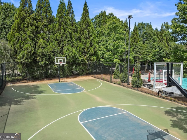 view of sport court with community basketball court and fence