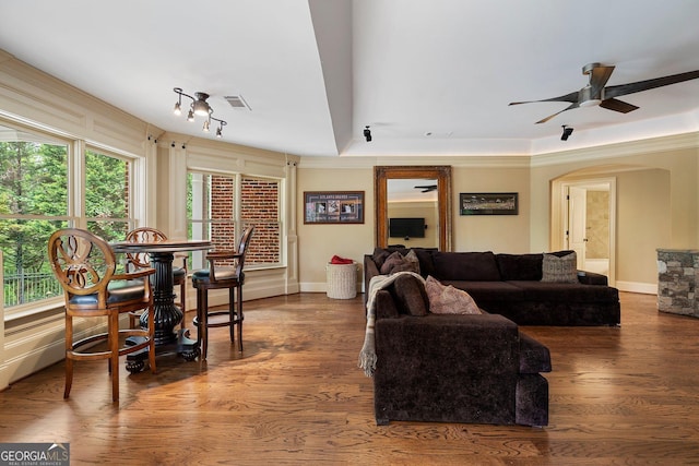living room featuring ceiling fan and wood finished floors
