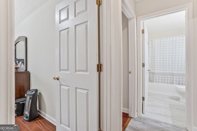 675 Michael Cir, Monroe, GA 30655 - hallway featuring baseboards and wood finished floors