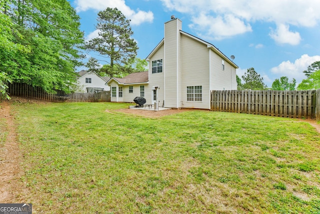 675 Michael Cir, Monroe, GA 30655 - rear view of property with a chimney and a patio