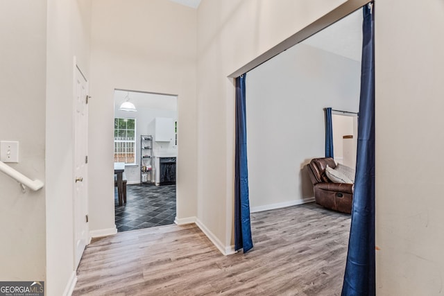 675 Michael Cir, Monroe, GA 30655 - corridor featuring wood finished floors, baseboards, and a towering ceiling