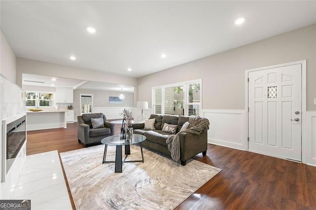 2490 Turtle Ter, Grayson, GA 30017 - living area featuring a decorative wall, recessed lighting, wainscoting, and wood finished floors