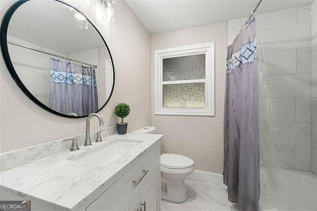 2490 Turtle Ter, Grayson, GA 30017 - bathroom featuring vanity, toilet, marble finish floor, and baseboards