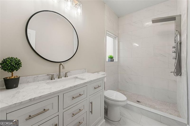 2490 Turtle Ter, Grayson, GA 30017 - full bathroom with tiled shower, marble finish floor, toilet, and vanity