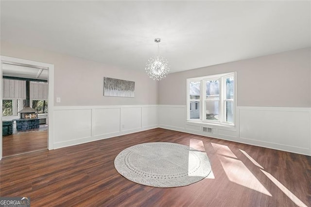 2490 Turtle Ter, Grayson, GA 30017 - unfurnished dining area featuring a wealth of natural light, a chandelier, visible vents, and wainscoting