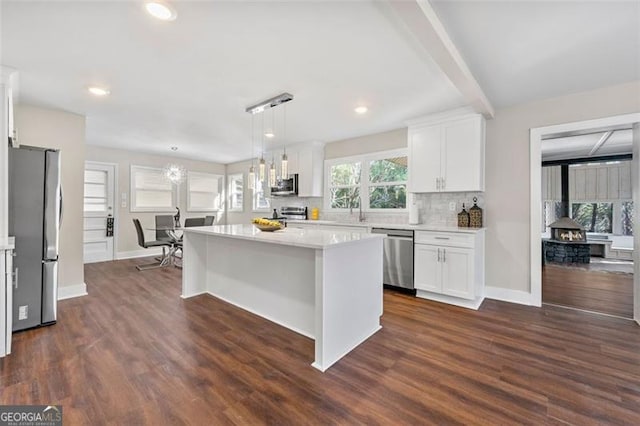2490 Turtle Ter, Grayson, GA 30017 - kitchen with white cabinets, a wealth of natural light, appliances with stainless steel finishes, and light countertops