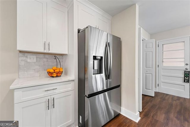 2490 Turtle Ter, Grayson, GA 30017 - kitchen with white cabinetry, decorative backsplash, light countertops, dark wood-style floors, and stainless steel fridge