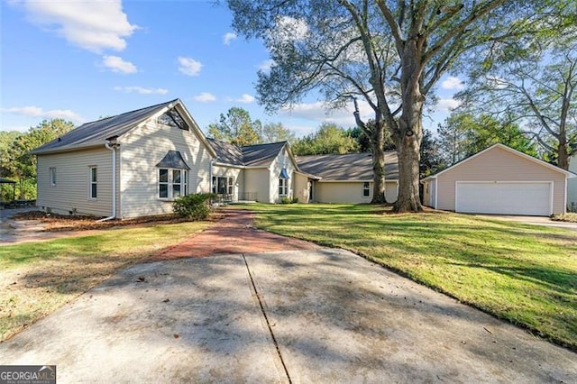 2490 Turtle Ter, Grayson, GA 30017 - view of front of home with an outbuilding, a front lawn, and a garage