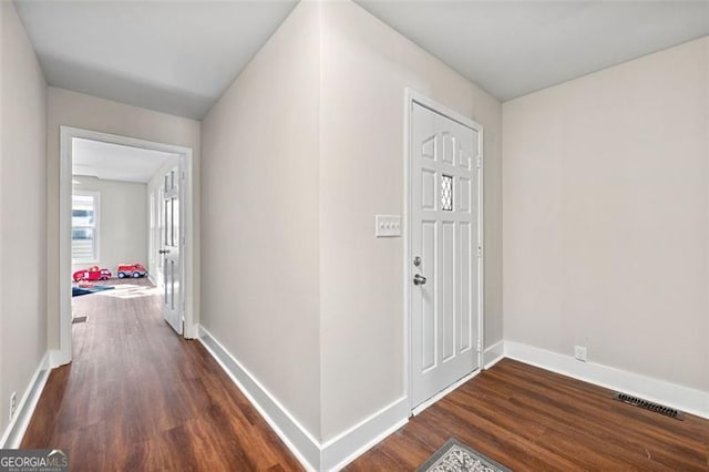 2490 Turtle Ter, Grayson, GA 30017 - entrance foyer with visible vents, dark wood-style flooring, and baseboards