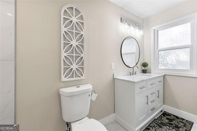 2490 Turtle Ter, Grayson, GA 30017 - bathroom with vanity, toilet, marble finish floor, and baseboards