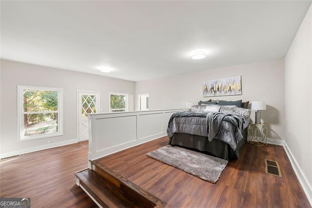 2490 Turtle Ter, Grayson, GA 30017 - bedroom featuring visible vents, wood finished floors, multiple windows, and baseboards