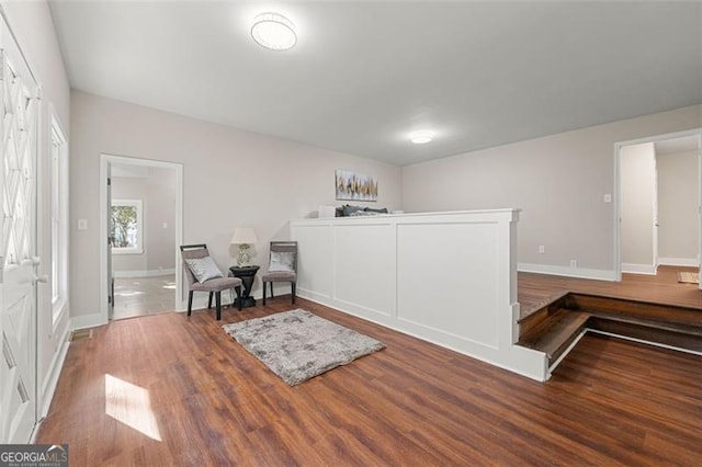 2490 Turtle Ter, Grayson, GA 30017 - living area featuring wood finished floors and baseboards