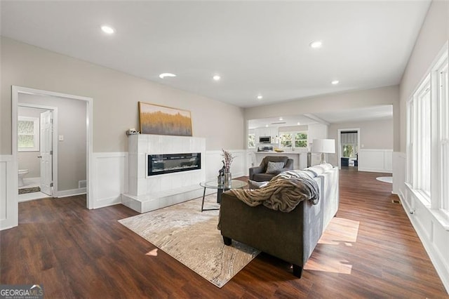 2490 Turtle Ter, Grayson, GA 30017 - living area with wainscoting, wood finished floors, and a fireplace