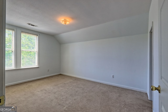 bonus room with visible vents, baseboards, carpet floors, and lofted ceiling