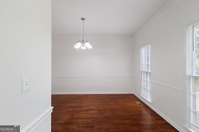 1720 Greystone Trce SE, Conyers, GA 30013 - unfurnished dining area featuring a chandelier, wood finished floors, crown molding, and baseboards
