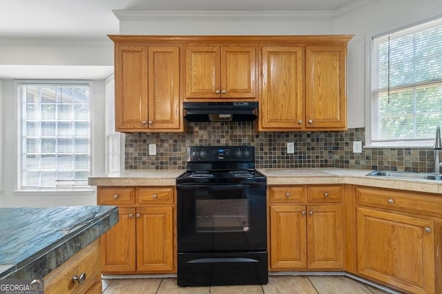 1720 Greystone Trce SE, Conyers, GA 30013 - kitchen with exhaust hood, black electric range, a sink, brown cabinets, and ornamental molding