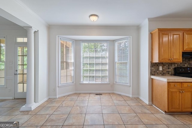 1720 Greystone Trce SE, Conyers, GA 30013 - kitchen featuring electric range, light countertops, tasteful backsplash, ornate columns, and ornamental molding