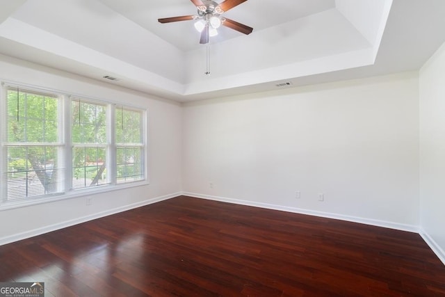 1720 Greystone Trce SE, Conyers, GA 30013 - empty room featuring hardwood / wood-style floors, ceiling fan, baseboards, and a tray ceiling