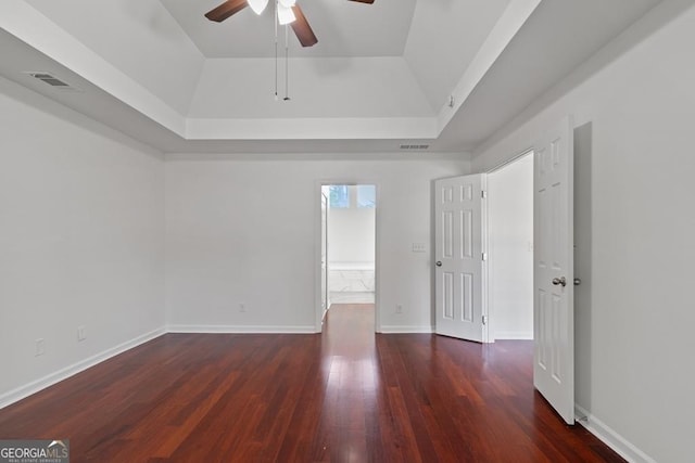 1720 Greystone Trce SE, Conyers, GA 30013 - spare room with a raised ceiling, ceiling fan, wood finished floors, and baseboards
