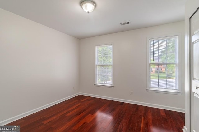 1720 Greystone Trce SE, Conyers, GA 30013 - empty room with wood finished floors and baseboards