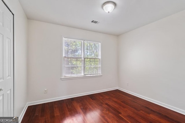 1720 Greystone Trce SE, Conyers, GA 30013 - unfurnished bedroom with dark wood-style floors and baseboards