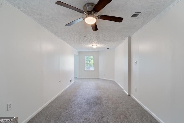 1720 Greystone Trce SE, Conyers, GA 30013 - spare room with a textured ceiling, baseboards, carpet, and a ceiling fan