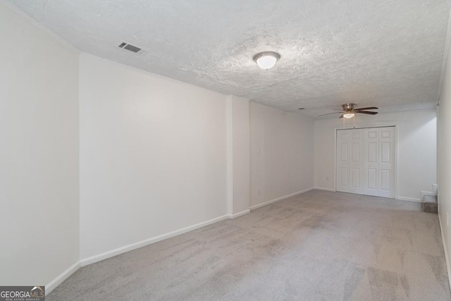 1720 Greystone Trce SE, Conyers, GA 30013 - unfurnished room featuring a ceiling fan, carpet, baseboards, a textured ceiling, and crown molding