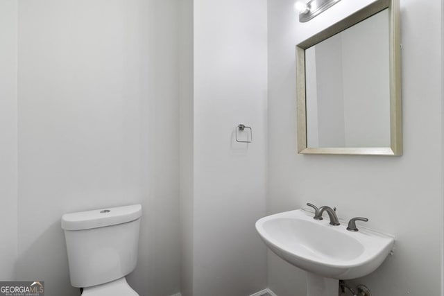 1720 Greystone Trce SE, Conyers, GA 30013 - half bath featuring a sink and toilet