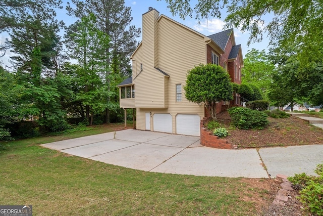 1720 Greystone Trce SE, Conyers, GA 30013 - view of property exterior featuring a chimney, a yard, a garage, and concrete driveway