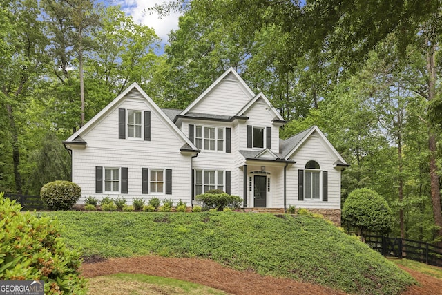 view of front of home with fence