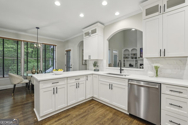 kitchen featuring a sink, dishwasher, light countertops, a peninsula, and recessed lighting