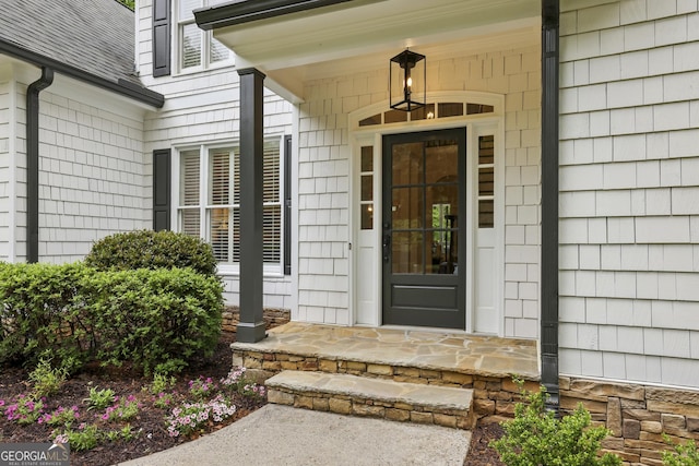 entrance to property featuring a porch