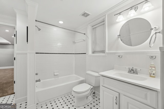 bathroom featuring visible vents, wainscoting, bathtub / shower combination, vanity, and toilet