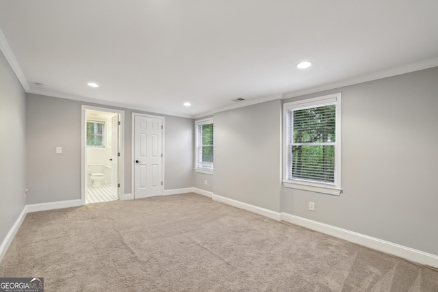 carpeted empty room with recessed lighting, baseboards, and ornamental molding