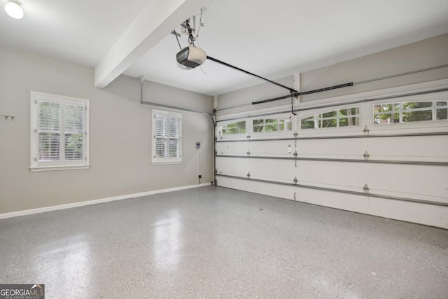 garage featuring baseboards and a garage door opener