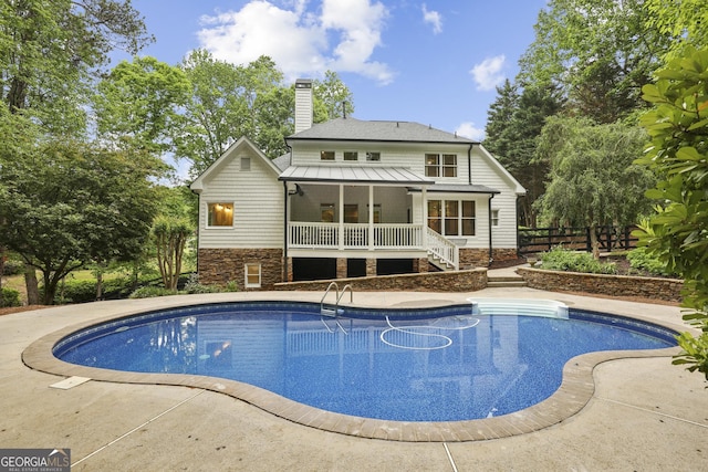 outdoor pool with stairway and fence