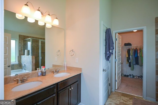 6816 Diamond Dr, Rex, GA 30273 - bathroom featuring a shower stall, double vanity, and a spacious closet