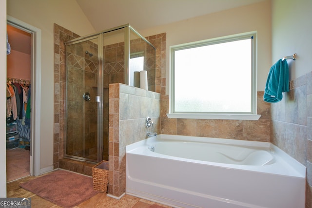 6816 Diamond Dr, Rex, GA 30273 - bathroom with a shower stall, a bath, and a spacious closet