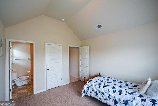 6816 Diamond Dr, Rex, GA 30273 - carpeted bedroom featuring vaulted ceiling and connected bathroom